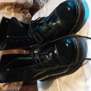 Doc Marten combat boots.